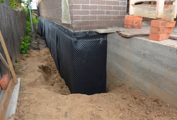 Happy homeowners after waterproofing job in Logansport